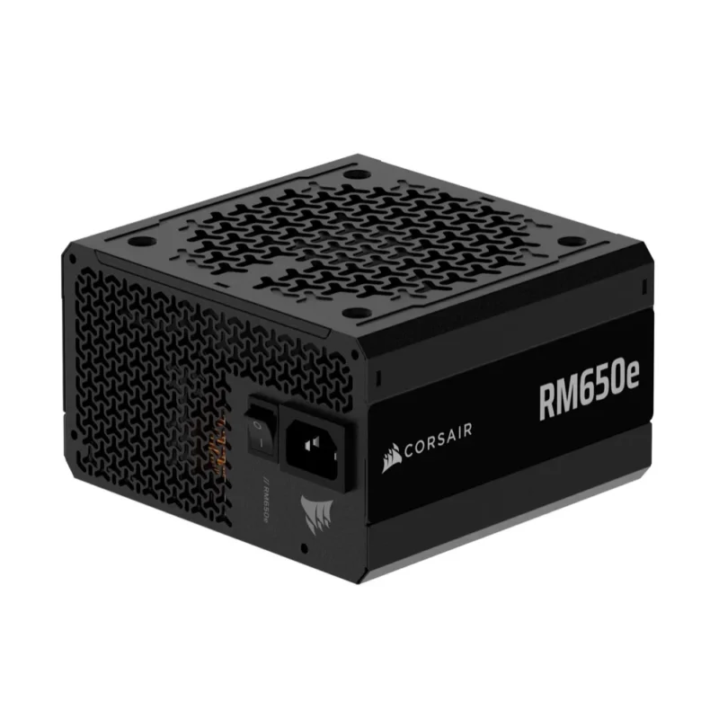 Top-down angle of the CORSAIR RM650e PSU, highlighting the fan grille and rear power switch.