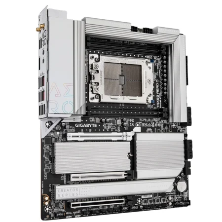 Angled view of the GIGABYTE TRX50 AERO D E-ATX motherboard showing the massive heatsinks.