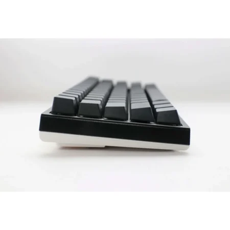A straight-on side view of the Ducky One 2 Pro Mini, showing the adjustable feet and dual-tone case design.