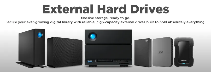 OnlyGaming category banner for External Hard Drives. The image displays a lineup of high-capacity portable and desktop external hard drives from top brands like LaCie, Seagate, and ADATA, featuring sleek desktop enclosures and rugged portable designs. The text reads: External Hard Drives. Massive storage, ready to go. Secure your ever-growing digital library with reliable, high-capacity external drives built to hold absolutely everything.